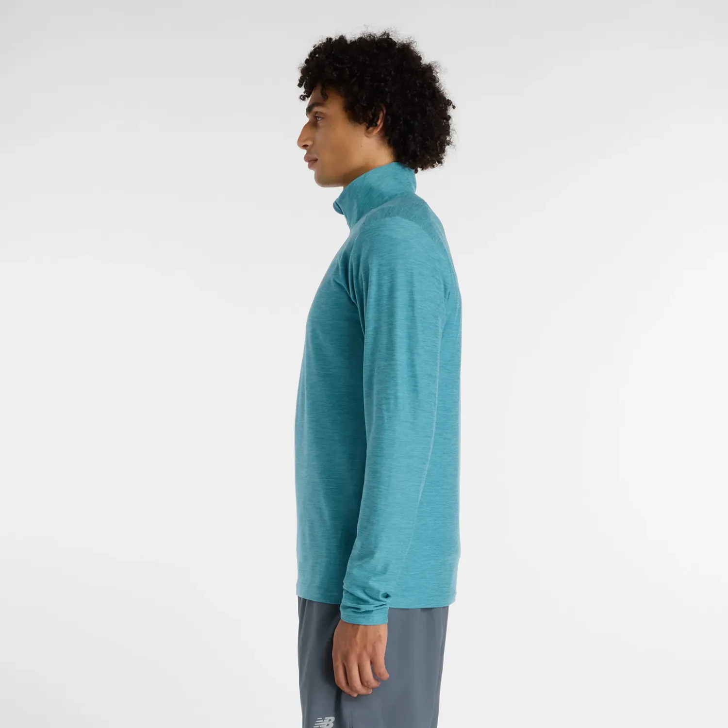 New Balance Casaca New Balance Training Hombre Space Dye 1/4 Zip color teal | Platanitos