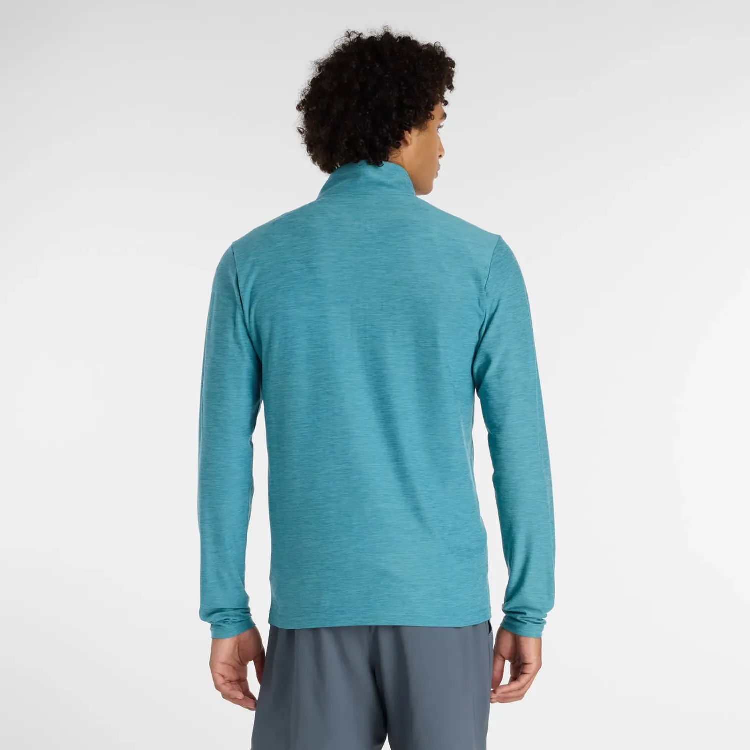 New Balance Casaca New Balance Training Hombre Space Dye 1/4 Zip color teal | Platanitos