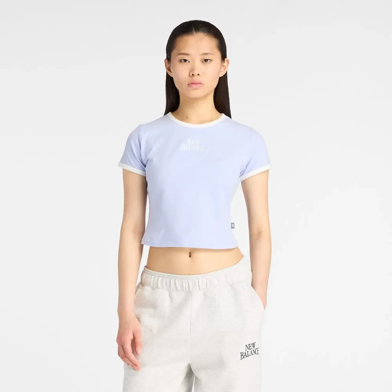 New Balance Polo New Balance Lifestyle Mujer Heritage Ringer color celeste / blanco | Platanitos