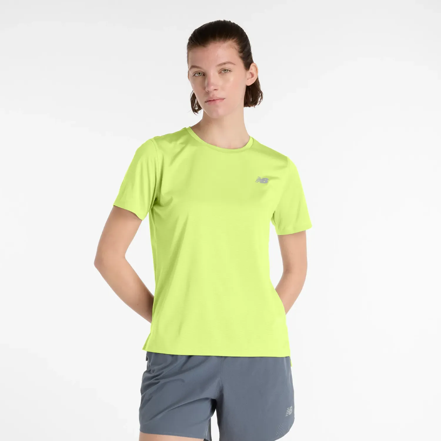 New Balance Polo New Balance Running Mujer Sport Essentials color amarillo | Platanitos