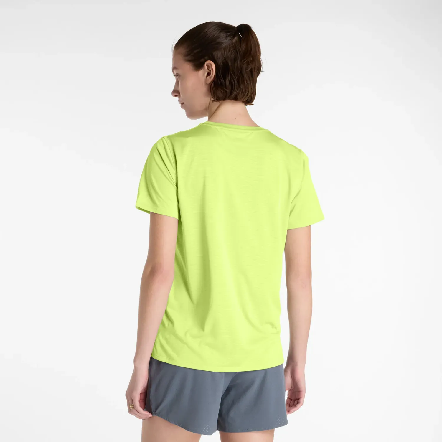 New Balance Polo New Balance Running Mujer Sport Essentials color amarillo | Platanitos