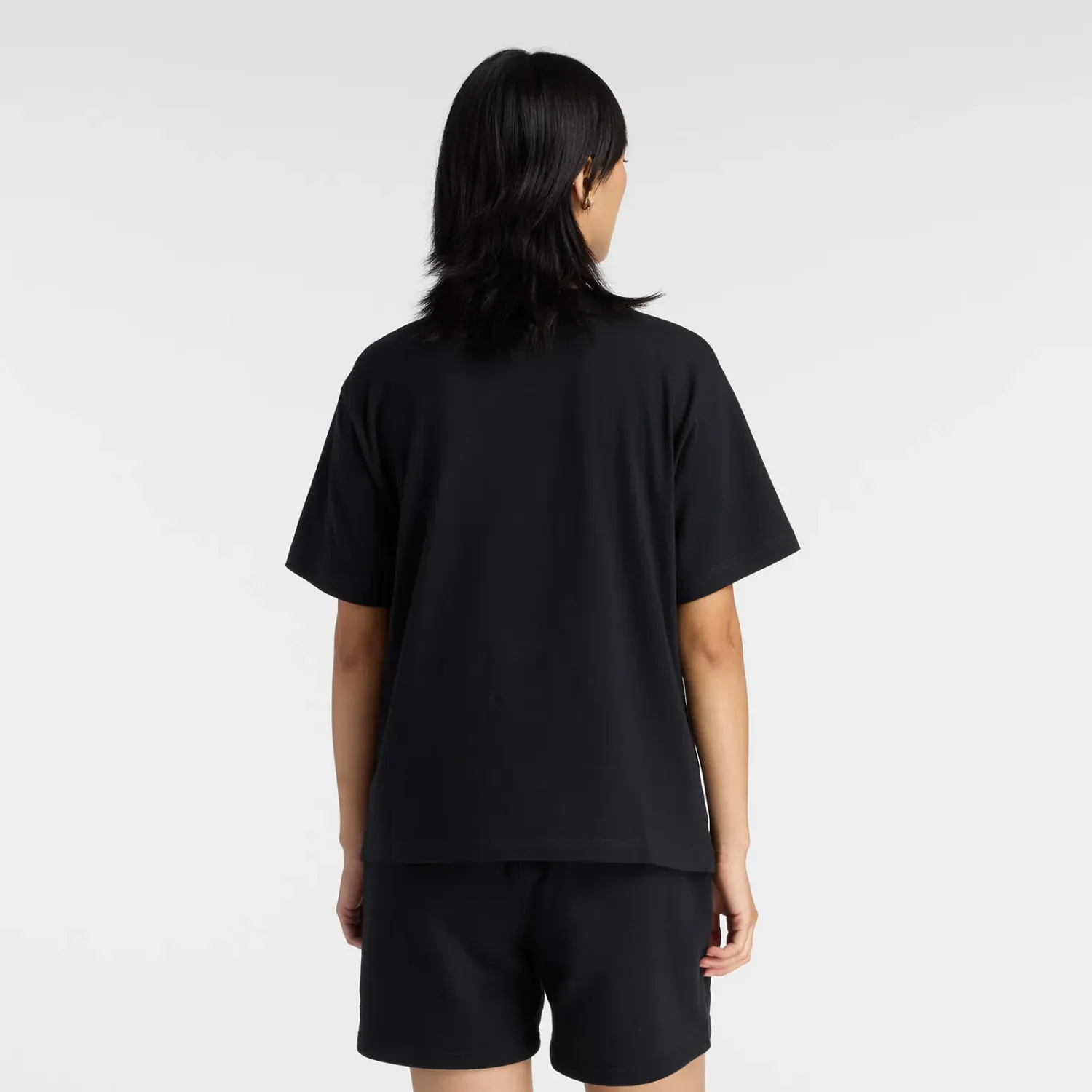 Polo New Balance Deportiva Mujer Lc Athletics T-Shirt color negro | Platanitos