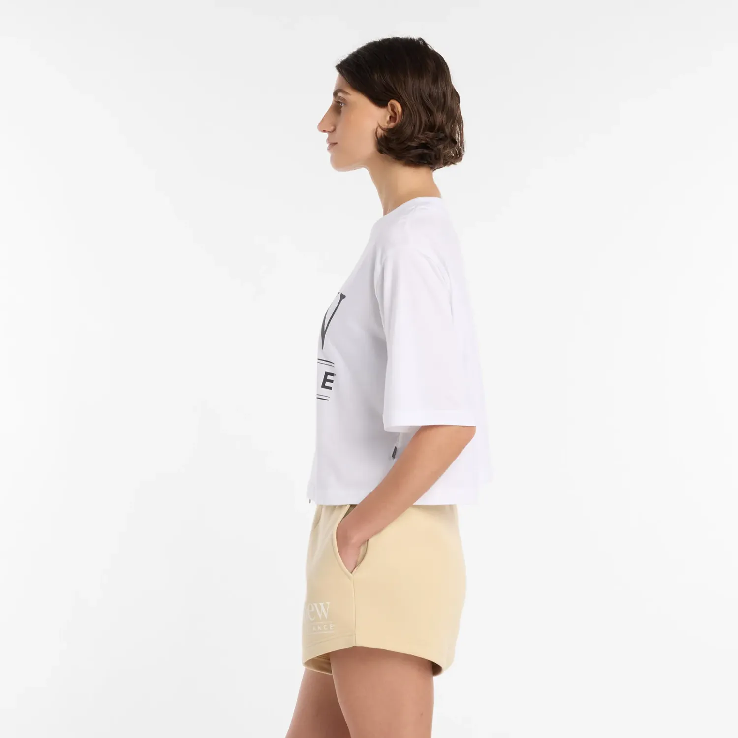 Polo New Balance Deportiva Mujer Reimagined Relaxed T-Shirt color blanco | Platanitos