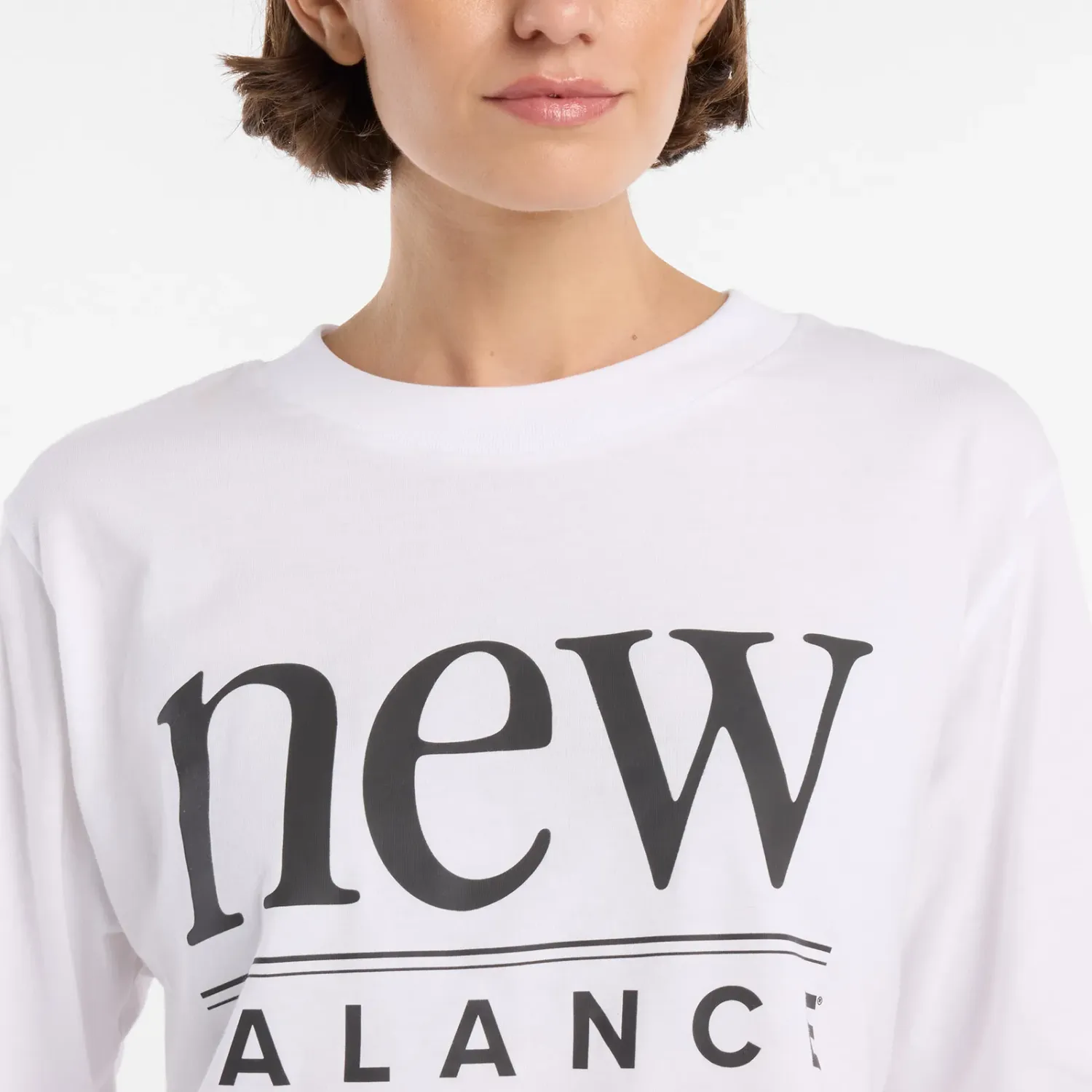 Polo New Balance Deportiva Mujer Reimagined Relaxed T-Shirt color blanco | Platanitos