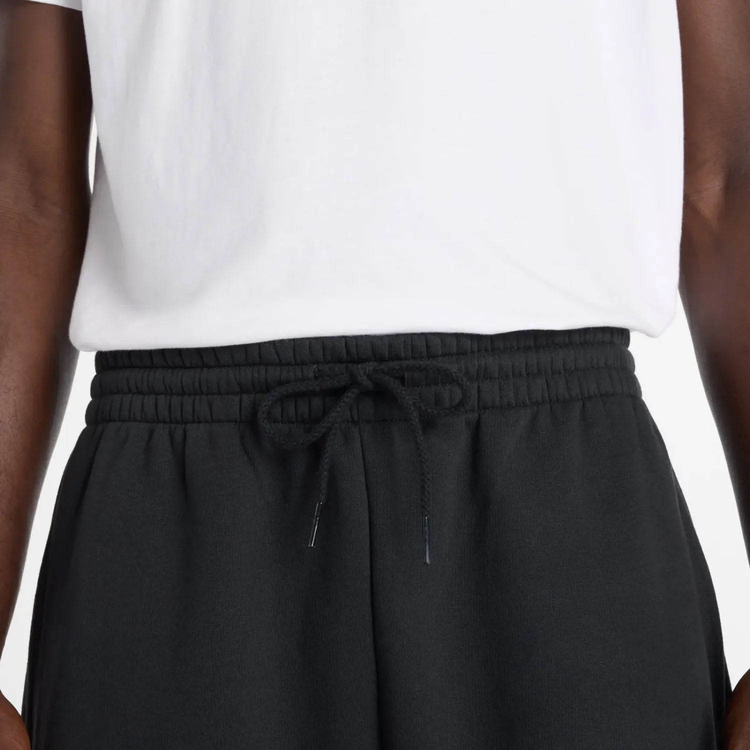 Jogger New Balance Deportiva Hombre Reimagined Fleece Jogger color negro | Platanitos