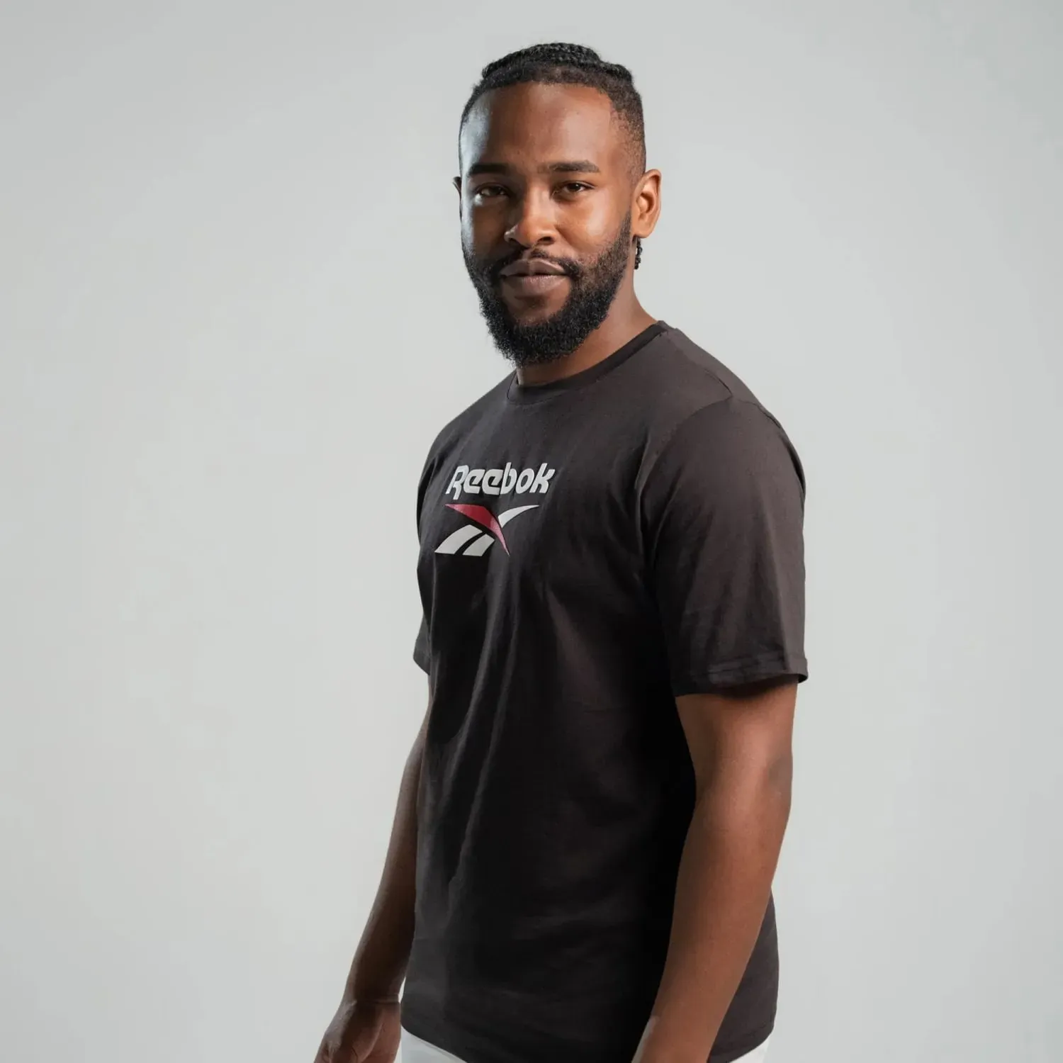 Polo Reebok Deportiva Hombre Mid Stack Logo color negro | Platanitos