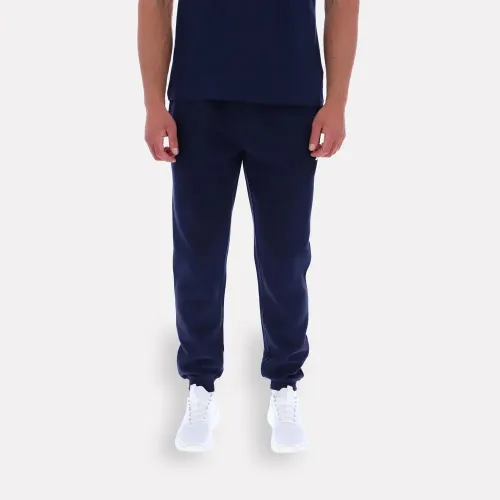Pantalon Reebok Deportiva Hombre Andre Small Logo Cuffed color azul | Platanitos