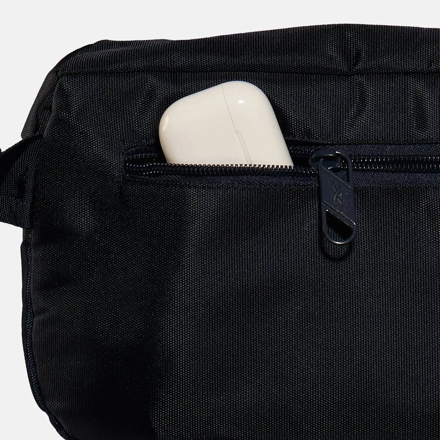 Canguro Reebok Training Unisex Lockup  Waistbag color negro | Platanitos