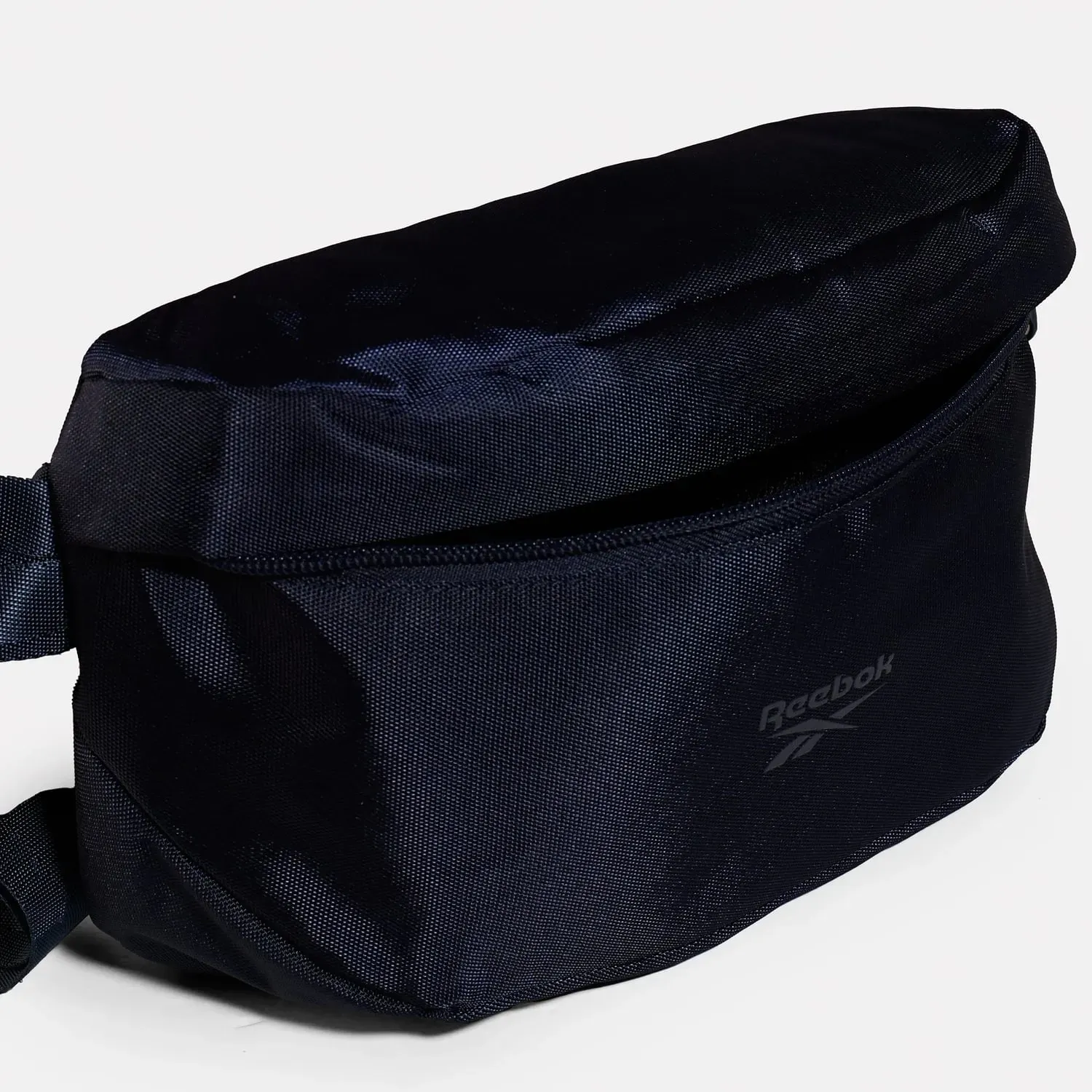 Canguro Reebok Training Unisex Lockup  Waistbag color negro | Platanitos