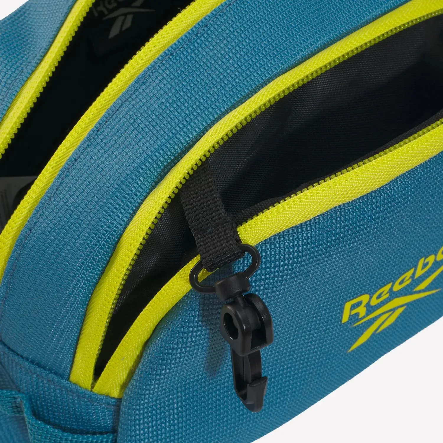 Canguro Reebok Training Unisex Rbk Restore Waistbag color azul | Platanitos